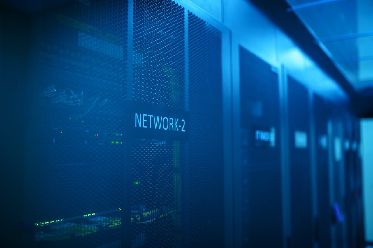 Network equipment with blue illumination representing self-hosted backend infrastructure